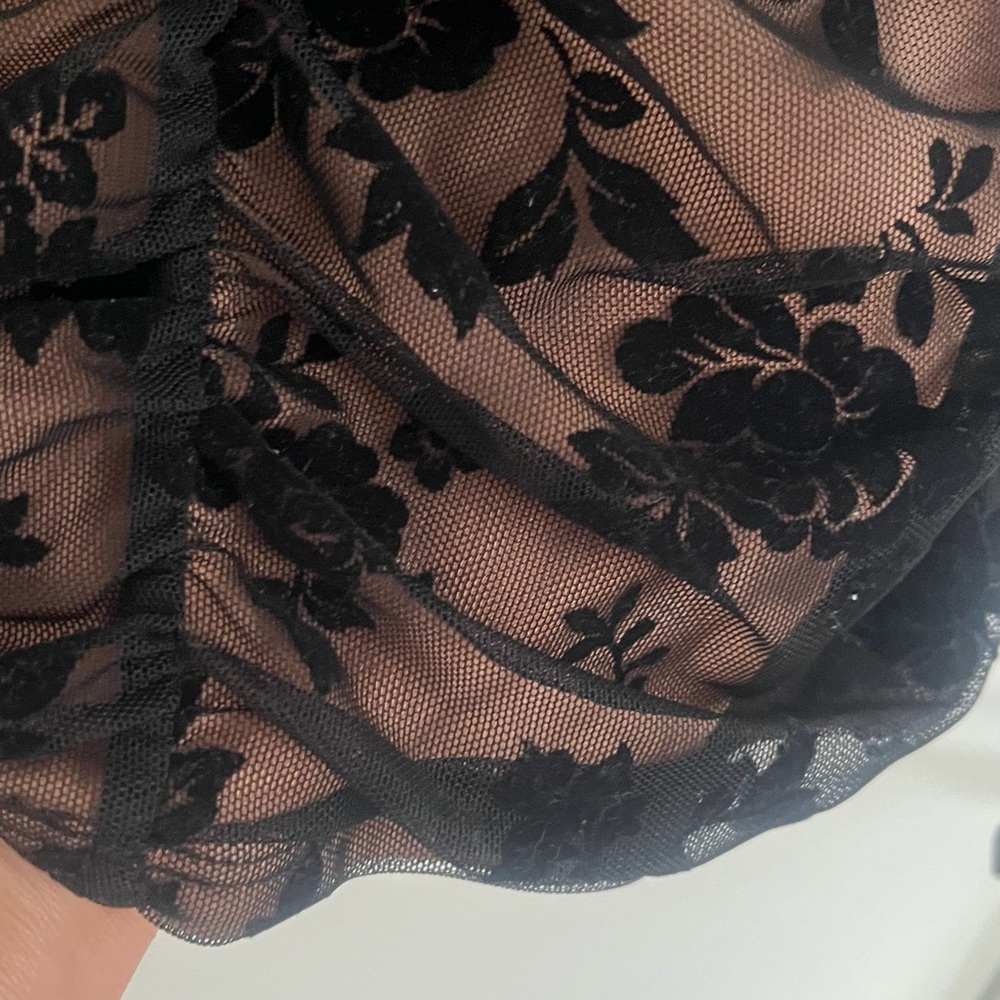 Black Floral Lace Fabric. Fits tight
